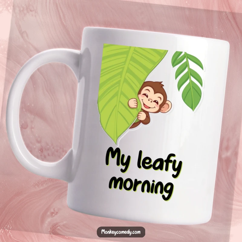 Funny Monkey Mug showing a monkey peeking with a wink from behind a tropical leaf, a playful jungle scene.