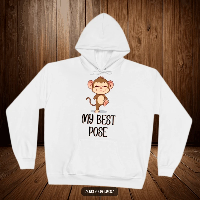Funny Monkey Hoodie showing a primate grimacing while balancing on one leg, depicting comic determination.