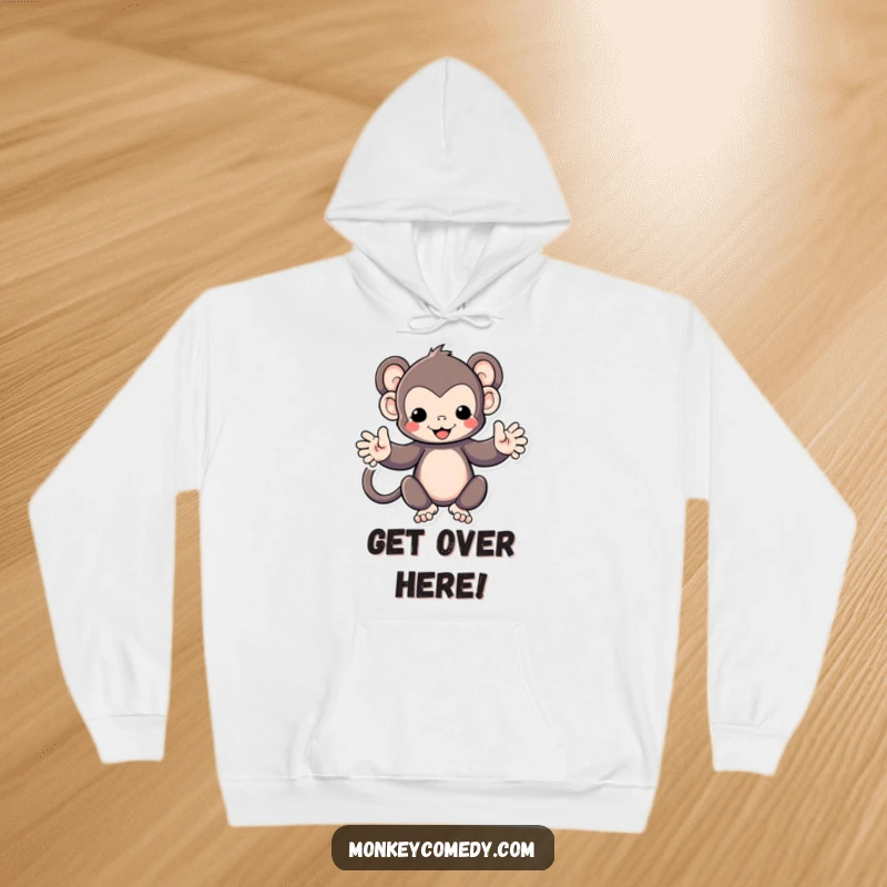 Funny Kawaii monkey with arms spread wide, offering a hug, on a comfortable hoodie, perfect for casual wear.