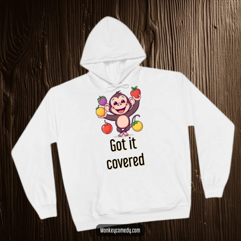 Funny monkey juggling fruits on a cozy hoodie, perfect for gifts.