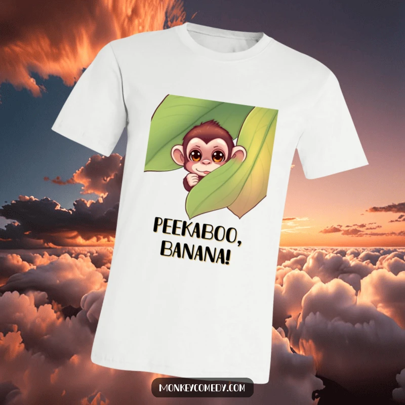 Funny monkey t-shirt with a small monkey’s curious eyes peeking from behind a large, colorful leaf, showcasing a humorous and intriguing moment.